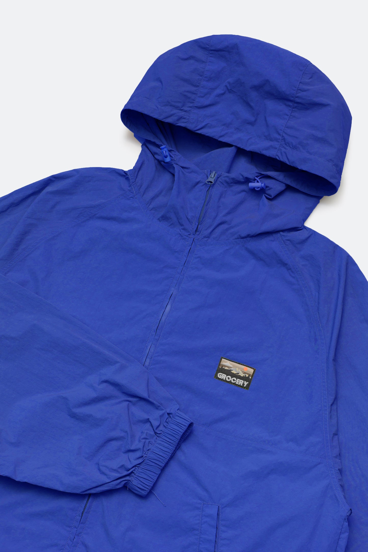 GROCERY PACKABLE NYLON WINDBREAKER/ BLUE