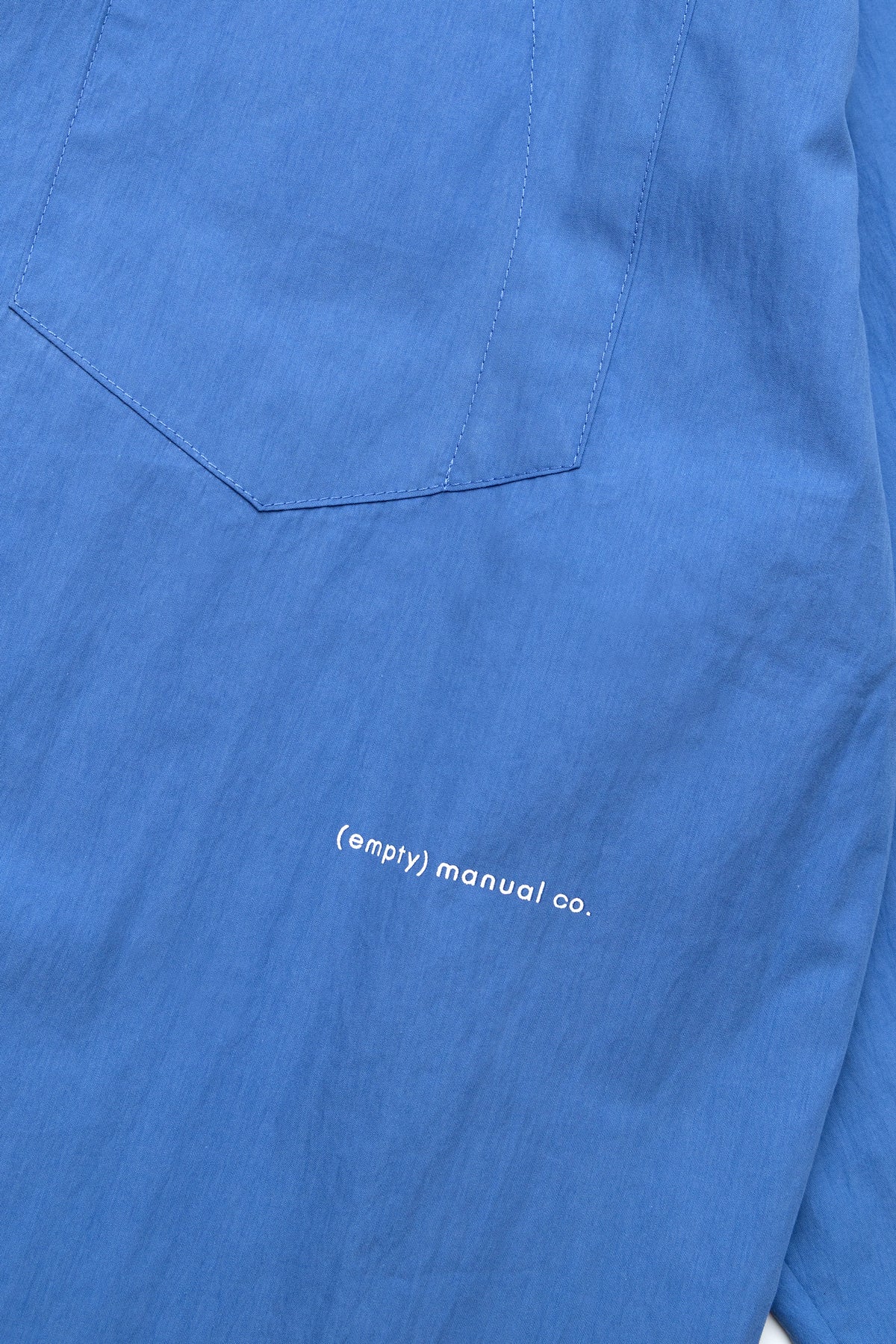 (empty) manual co. curved placket long sleeve shirt/ elemental blue