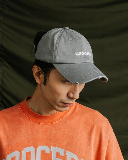 GROCERY LIGHT WASHED DISTRESSED CAP/ LIGHT GREY
