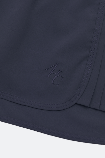 Aim Higher Club Active to Street Pleat Skort/ Navy - GROGROCERY
