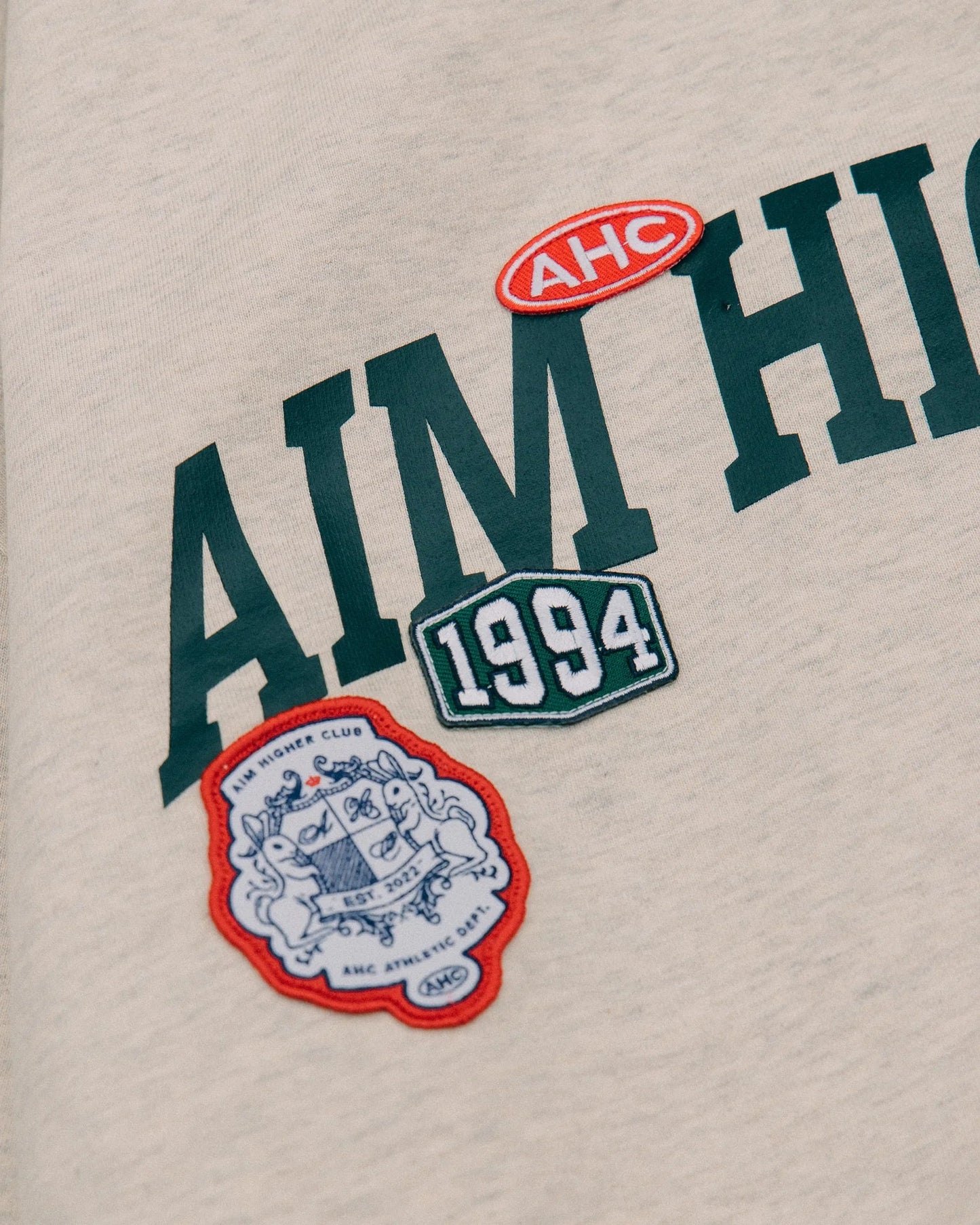 Aim Higher Club Unisex College Badge Crewneck Sweatshirt/ Oat - GROGROCERY
