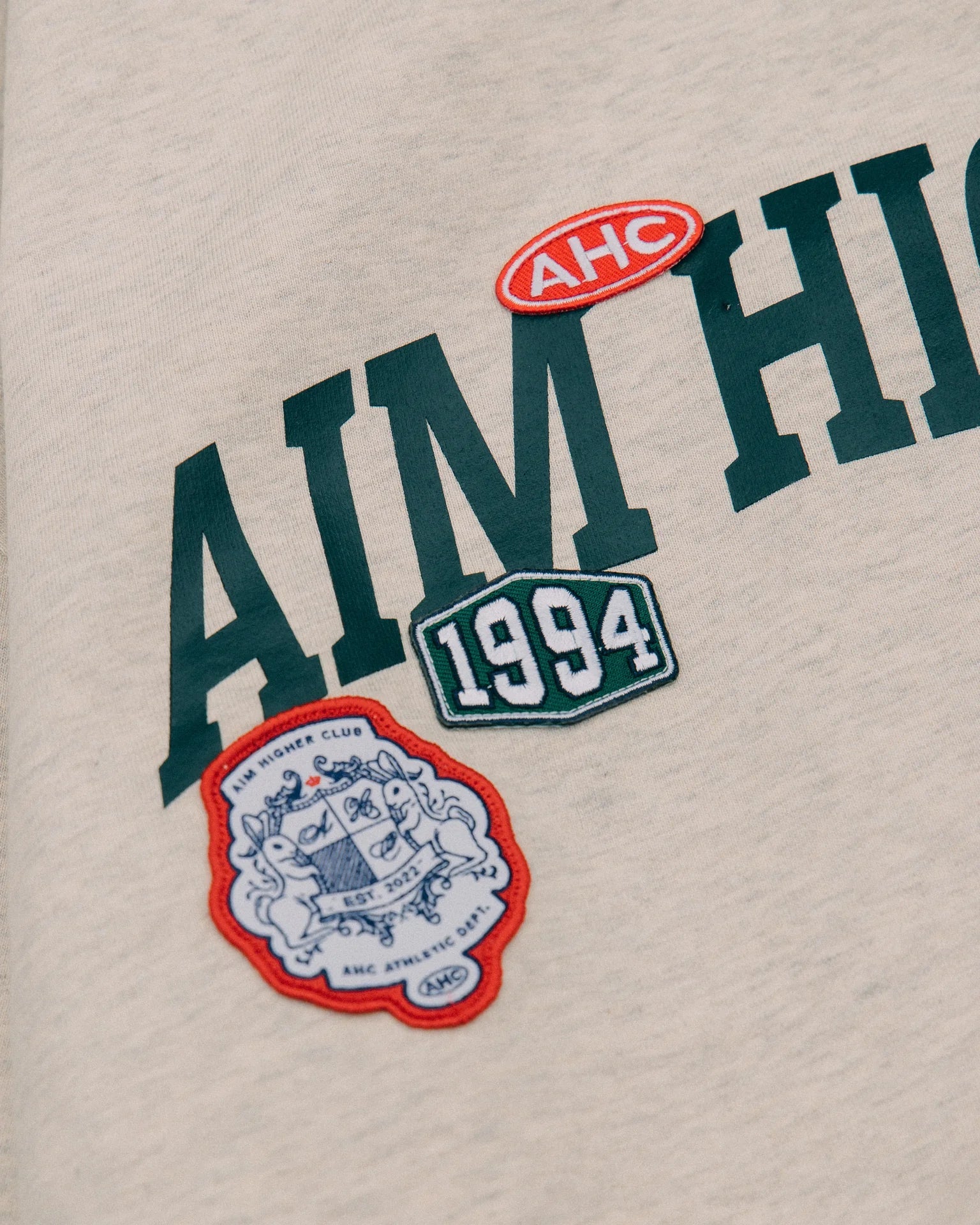 Aim Higher Club Unisex College Badge Crewneck Sweatshirt/ Oat - GROGROCERY