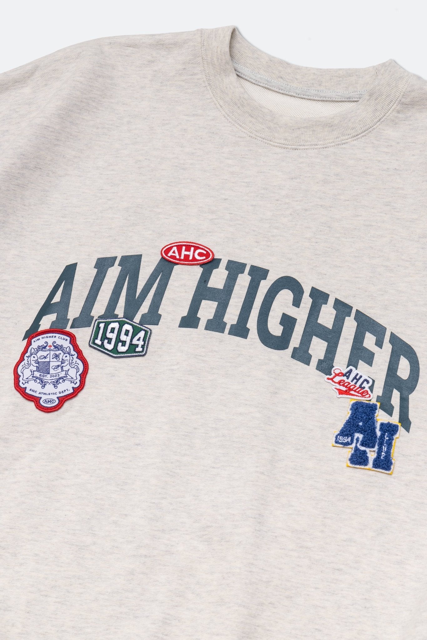 Aim Higher Club Unisex College Badge Crewneck Sweatshirt/ Oat - GROGROCERY