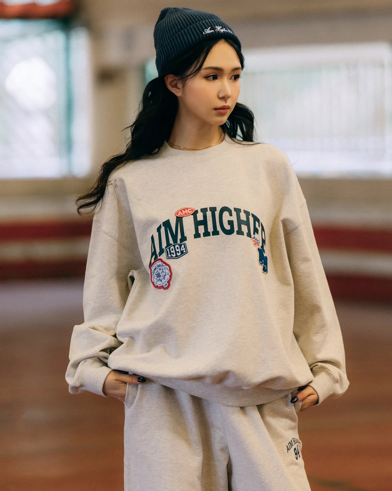 Aim Higher Club Unisex College Badge Crewneck Sweatshirt/ Oat - GROGROCERY