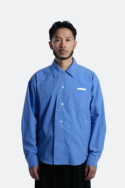 (empty) manual co. curved placket long sleeve shirt/ elemental blue