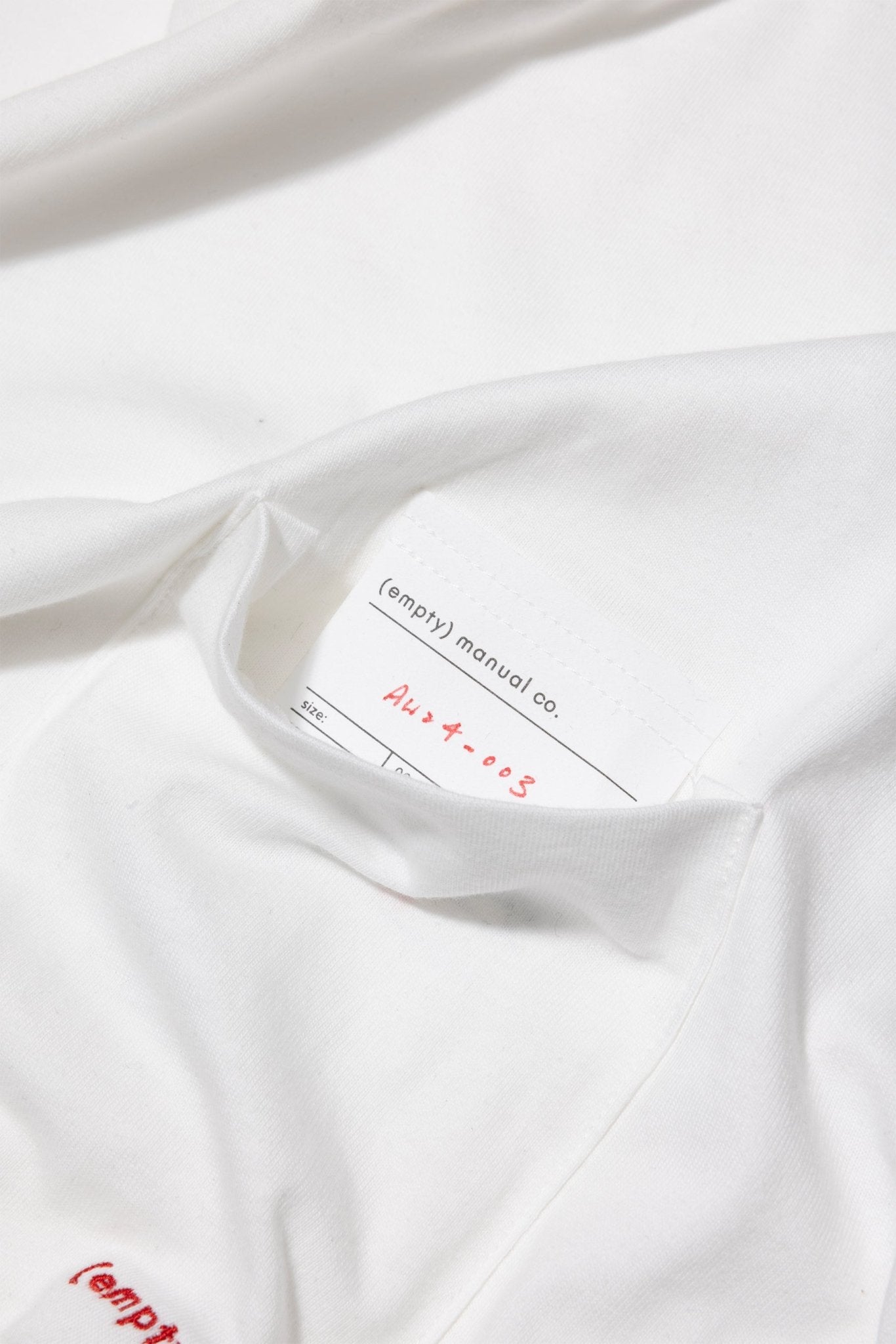 (empty) manual co. red embroidery L/S tee/ white - GROGROCERY